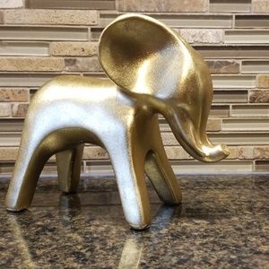 Faux gold elephant,  trunk up. Chick.